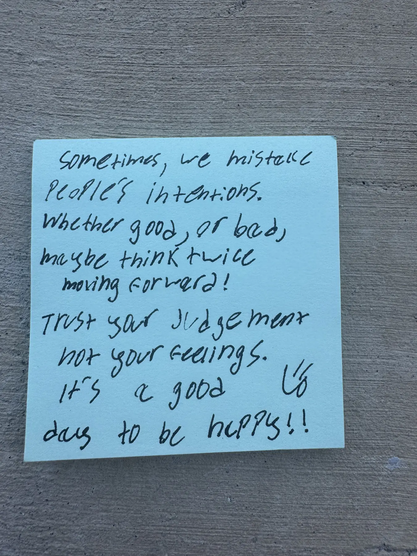 Handwritten sticky note with words of encouragement